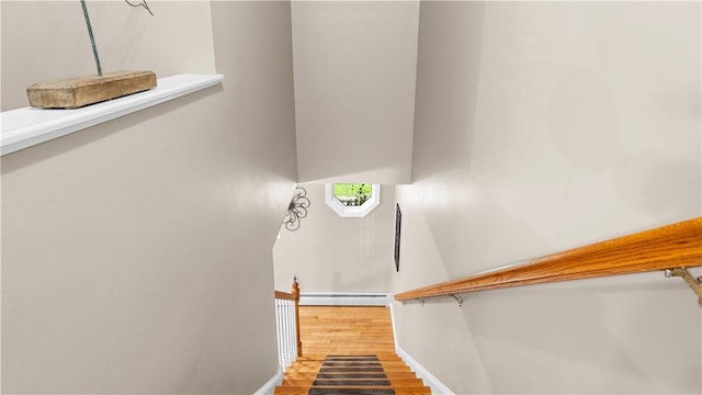 605 Gardner Rd, Exeter, RI 02822 - staircase featuring a baseboard radiator, baseboards, and wood finished floors