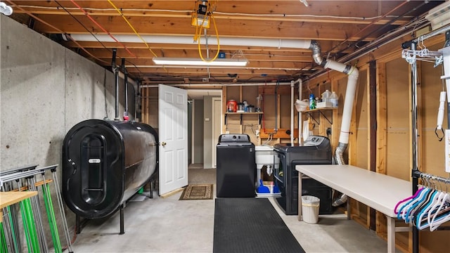605 Gardner Rd, Exeter, RI 02822 - basement with heating fuel, washer and dryer, and a sink