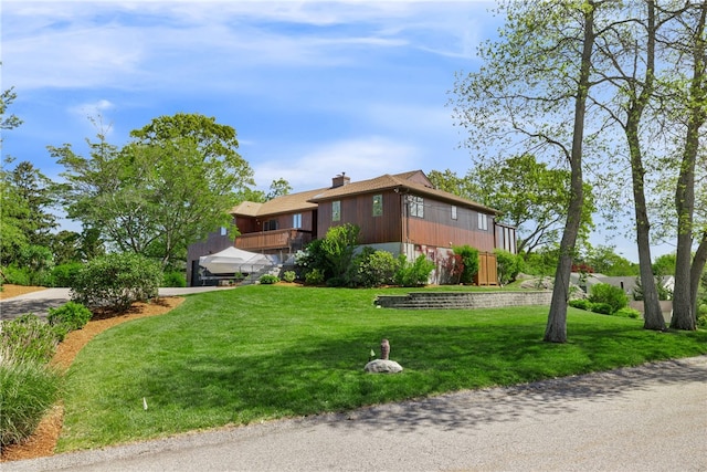 11 Cove Rd, Narragansett, RI 02882 - view of property exterior with a yard, a chimney, and driveway