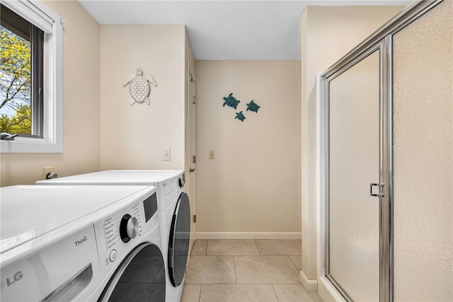 11 Cove Rd, Narragansett, RI 02882 - laundry room featuring washing machine and dryer, light tile patterned floors, and baseboards