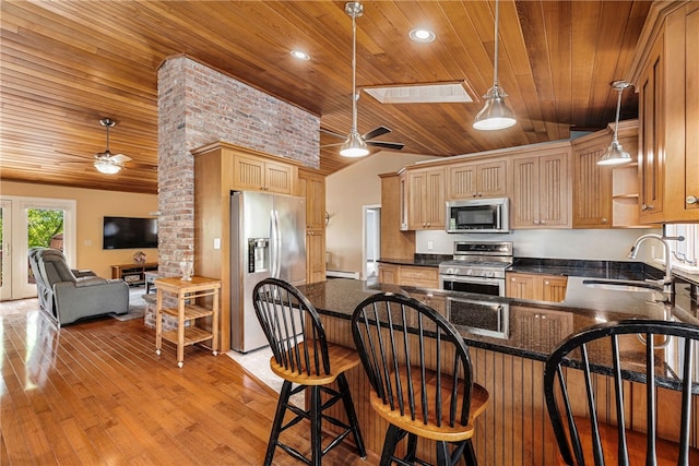11 Cove Rd, Narragansett, RI 02882 - kitchen with appliances with stainless steel finishes, ceiling fan, wooden ceiling, a sink, and lofted ceiling
