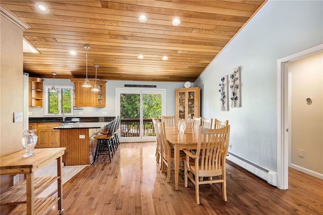11 Cove Rd, Narragansett, RI 02882 - dining area with baseboard heating, wood ceiling, plenty of natural light, and light wood-style flooring