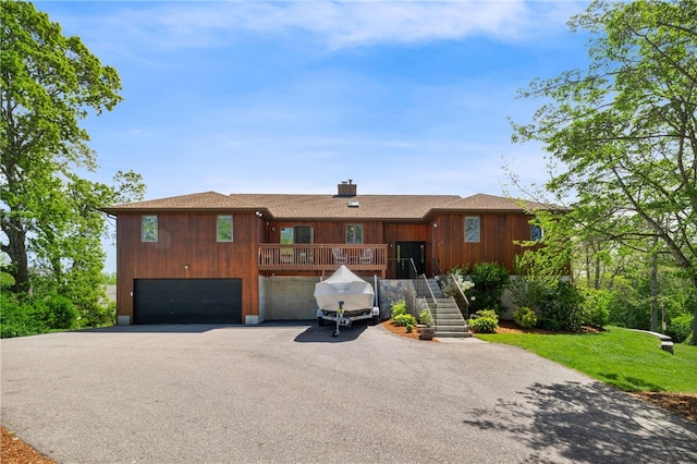 11 Cove Rd, Narragansett, RI 02882 - ranch-style house with driveway, stairs, a garage, and a chimney