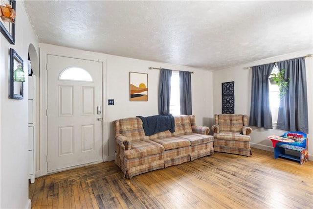 58 Edgemere Rd, Pawtucket, RI 02861 - living room featuring hardwood / wood-style floors, a textured ceiling, and baseboards