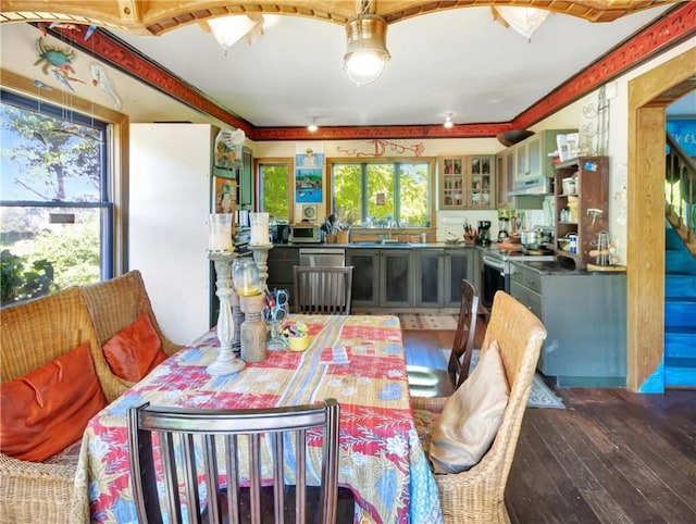 219 Nanaquaket Rd, Tiverton, RI 02878 - dining room featuring wood-type flooring and stairs
