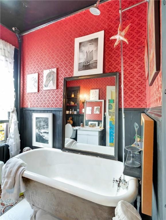 219 Nanaquaket Rd, Tiverton, RI 02878 - full bathroom featuring wallpapered walls, wainscoting, and a garden tub