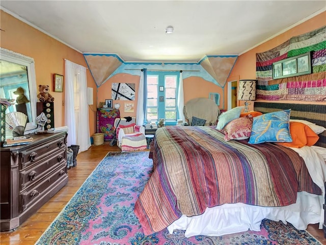 219 Nanaquaket Rd, Tiverton, RI 02878 - bedroom with light wood-style flooring and ornamental molding