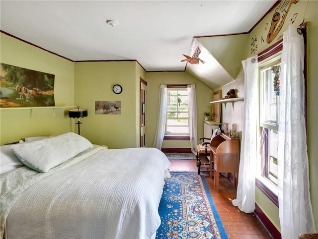 219 Nanaquaket Rd, Tiverton, RI 02878 - bedroom with wood finished floors, crown molding, baseboards, and vaulted ceiling