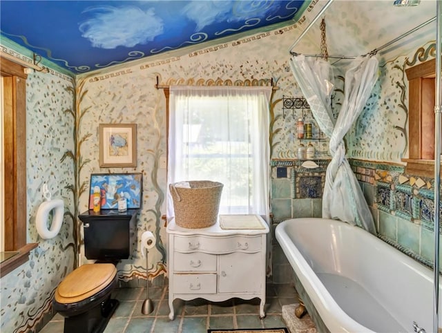 219 Nanaquaket Rd, Tiverton, RI 02878 - full bath featuring wallpapered walls, a soaking tub, tile patterned flooring, and toilet