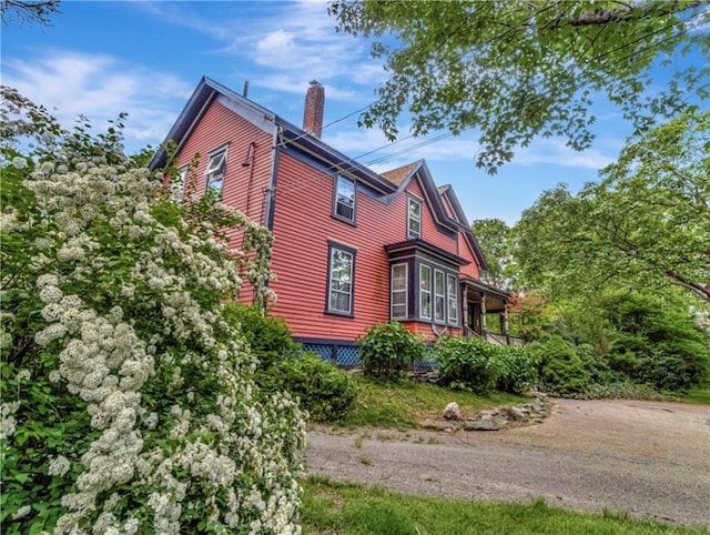 219 Nanaquaket Rd, Tiverton, RI 02878 - view of side of home with a chimney