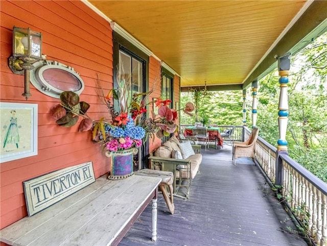 219 Nanaquaket Rd, Tiverton, RI 02878 - wooden porch featuring outdoor dining space