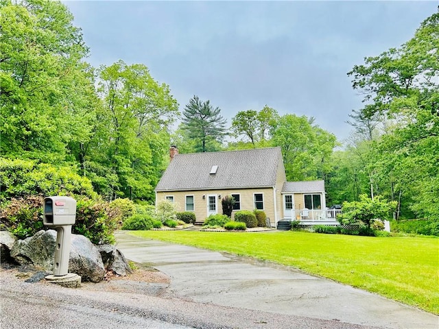 261 John Potter Rd, West Greenwich, RI 02817 - cape cod home featuring a front lawn and a chimney