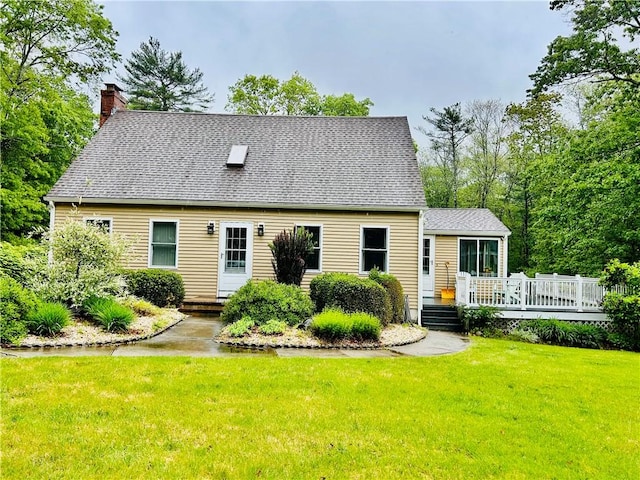 261 John Potter Rd, West Greenwich, RI 02817 - cape cod house with a chimney, a front yard, roof with shingles, and a wooden deck