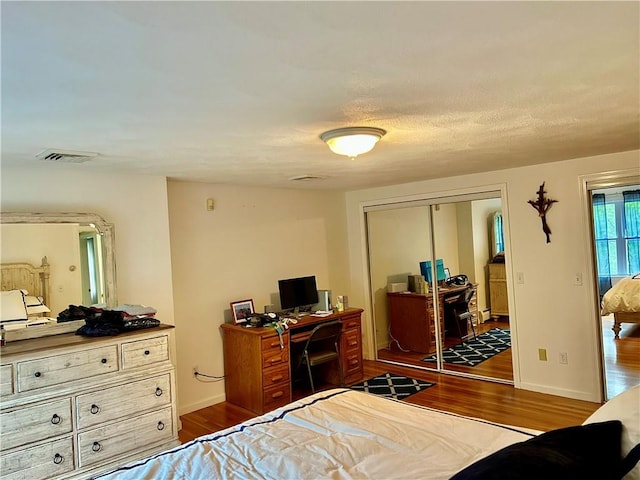261 John Potter Rd, West Greenwich, RI 02817 - bedroom featuring wood finished floors, a closet, and baseboards
