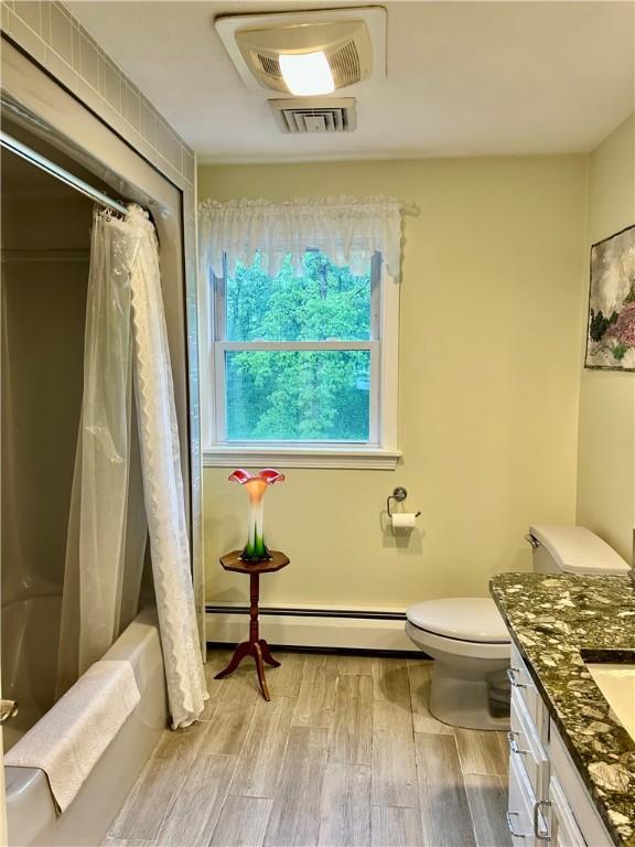 261 John Potter Rd, West Greenwich, RI 02817 - full bath featuring a baseboard radiator, wood finished floors, toilet, vanity, and shower / tub combo with curtain