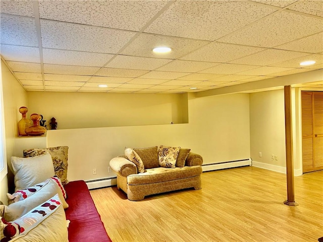 261 John Potter Rd, West Greenwich, RI 02817 - living room featuring a baseboard radiator, wood finished floors, recessed lighting, and baseboards
