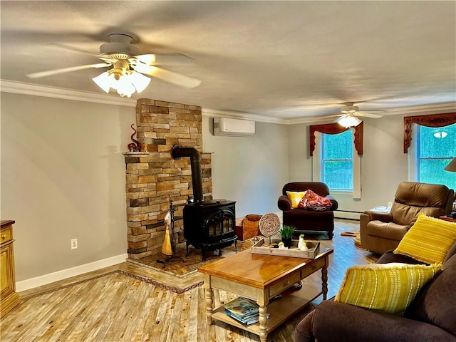 261 John Potter Rd, West Greenwich, RI 02817 - living area featuring ceiling fan, an AC wall unit, a wood stove, light wood finished floors, and crown molding