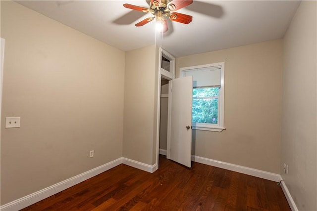 18 Railroad Ave, South Kingstown, RI 02892 - unfurnished bedroom with baseboards, dark wood finished floors, and a ceiling fan
