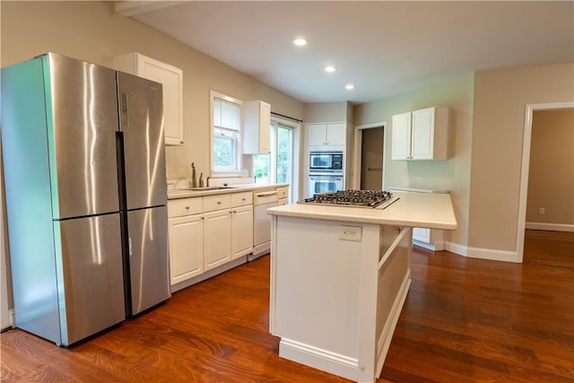 18 Railroad Ave, South Kingstown, RI 02892 - kitchen featuring appliances with stainless steel finishes, a sink, white cabinets, a center island, and recessed lighting