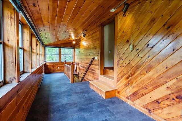 18 Railroad Ave, South Kingstown, RI 02892 - hallway featuring wooden walls, an upstairs landing, wood ceiling, a baseboard radiator, and lofted ceiling