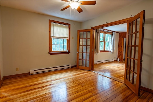 18 Railroad Ave, South Kingstown, RI 02892 - unfurnished room featuring baseboard heating, french doors, and light wood-style flooring