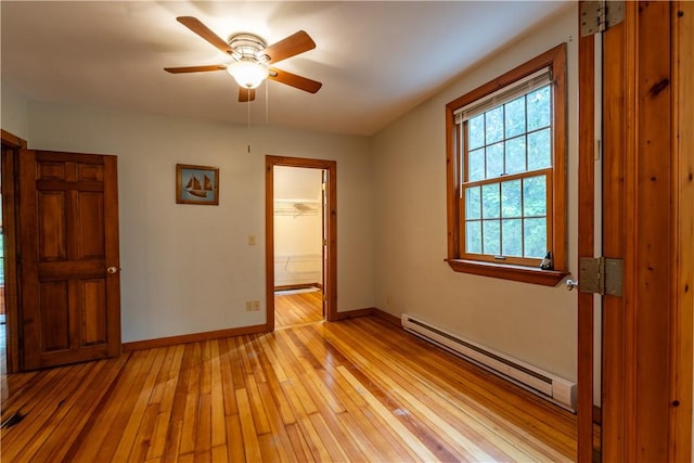 18 Railroad Ave, South Kingstown, RI 02892 - unfurnished room featuring baseboard heating, light wood-style floors, baseboards, and a ceiling fan