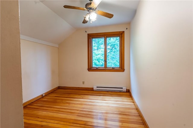 18 Railroad Ave, South Kingstown, RI 02892 - additional living space featuring a baseboard heating unit, light wood-style floors, vaulted ceiling, baseboards, and a ceiling fan
