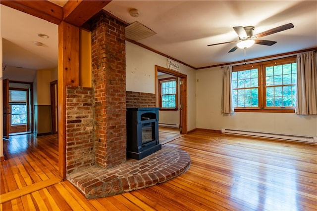 18 Railroad Ave, South Kingstown, RI 02892 - unfurnished living room with a baseboard heating unit, light wood-style flooring, baseboard heating, ceiling fan, and a fireplace