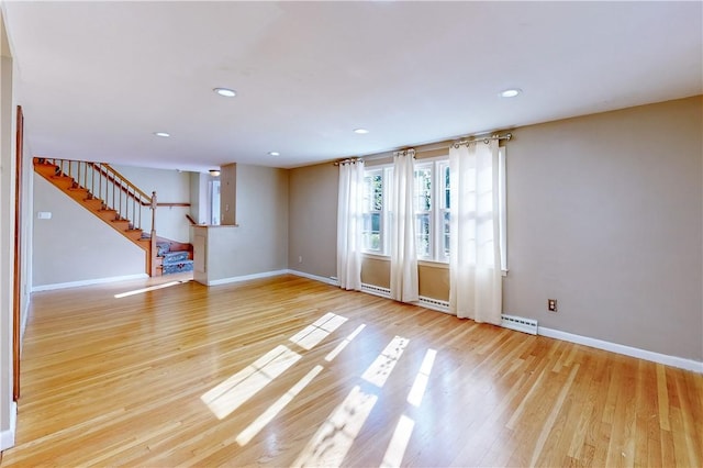 23 Sarah St, Providence, RI 02906 - spare room with stairway, baseboards, wood finished floors, and recessed lighting