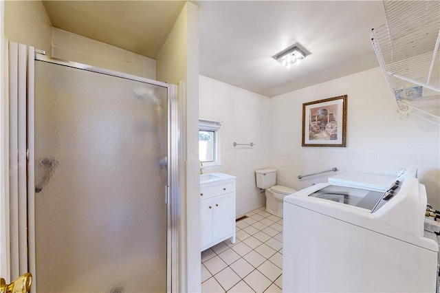 23 Sarah St, Providence, RI 02906 - laundry room with light tile patterned flooring, independent washer and dryer, and tile walls
