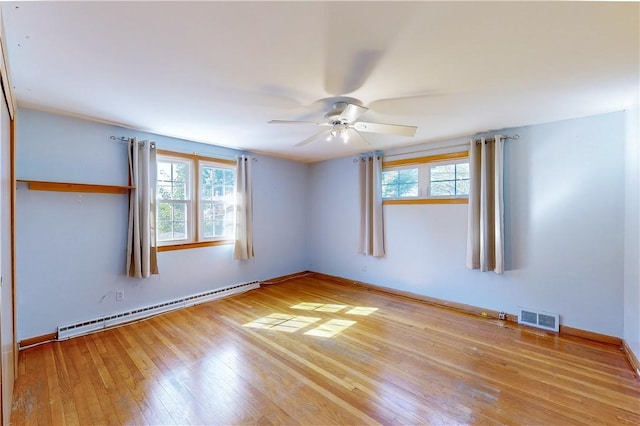23 Sarah St, Providence, RI 02906 - unfurnished room with baseboard heating, plenty of natural light, ceiling fan, and light wood-style floors