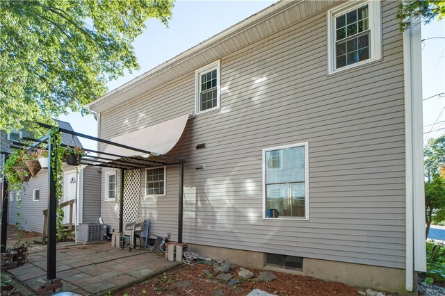 23 Sarah St, Providence, RI 02906 - back of house with cooling unit and a patio area