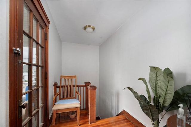 85 Englewood Ave, Pawtucket, RI 02860 - sitting room featuring wood finished floors, baseboards, and an upstairs landing
