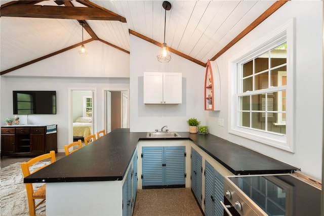 25 Melissa Ln, Burrillville, RI 02859 - kitchen featuring dark countertops, vaulted ceiling, white cabinets, a sink, and a peninsula