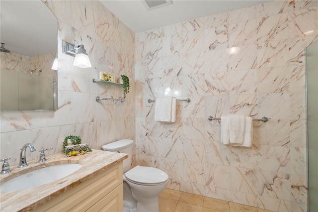 341 Thames St Unit 103, Bristol, RI 02809 - full bath featuring tile walls, vanity, toilet, tile patterned floors, and a shower