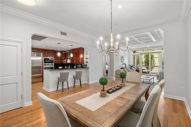 341 Thames St Unit 103, Bristol, RI 02809 - dining space with a chandelier, recessed lighting, coffered ceiling, light wood-style floors, and ornamental molding