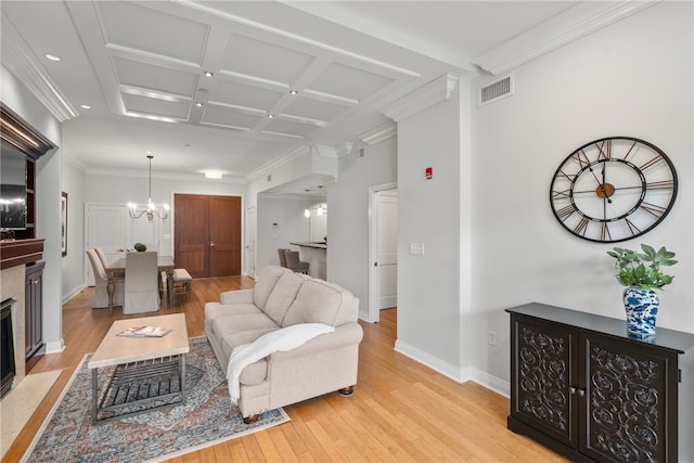 341 Thames St Unit 103, Bristol, RI 02809 - living room with light wood-style floors, a chandelier, baseboards, coffered ceiling, and crown molding