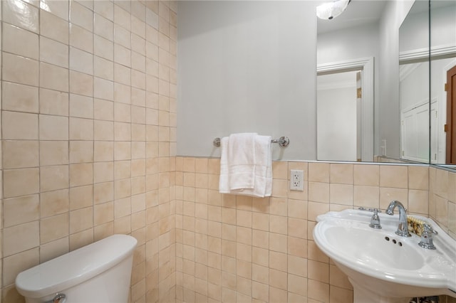 341 Thames St Unit 103, Bristol, RI 02809 - bathroom featuring tile walls, toilet, and a sink