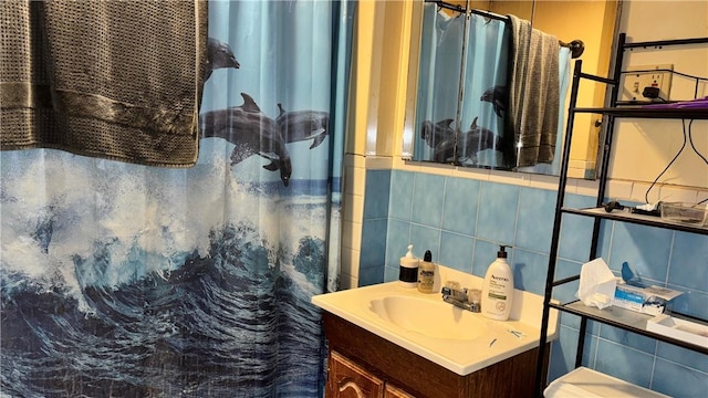 155 Thomas St, Woonsocket, RI 02895 - bathroom with vanity, curtained shower, tile walls, and tasteful backsplash