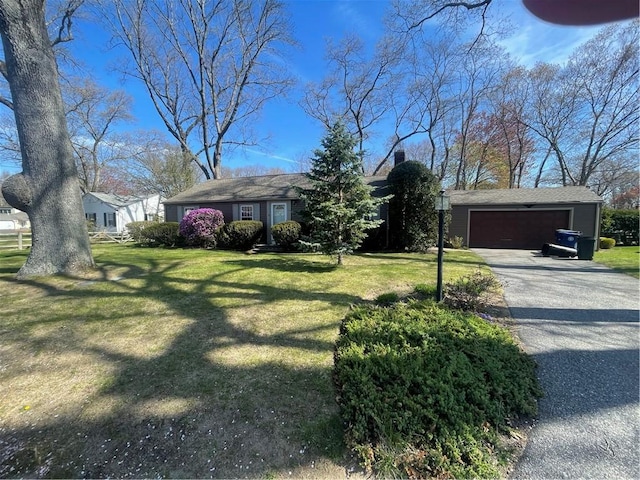 80 Frontier Rd, Warwick, RI 02889 - view of front facade featuring a garage, a front yard, a chimney, and driveway