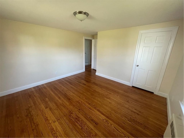80 Frontier Rd, Warwick, RI 02889 - unfurnished bedroom featuring dark wood-type flooring and baseboards