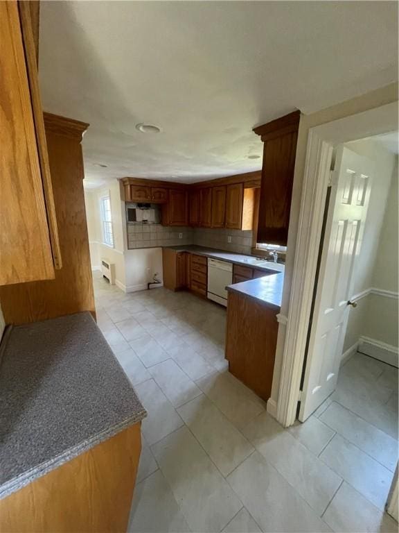 80 Frontier Rd, Warwick, RI 02889 - kitchen featuring dishwasher, baseboards, backsplash, and light tile patterned flooring