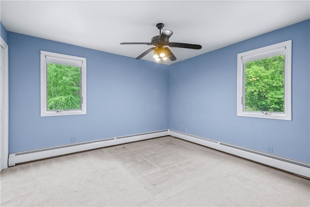 121 W Shore Dr, Exeter, RI 02822 - carpeted spare room featuring a baseboard heating unit, healthy amount of natural light, and a ceiling fan