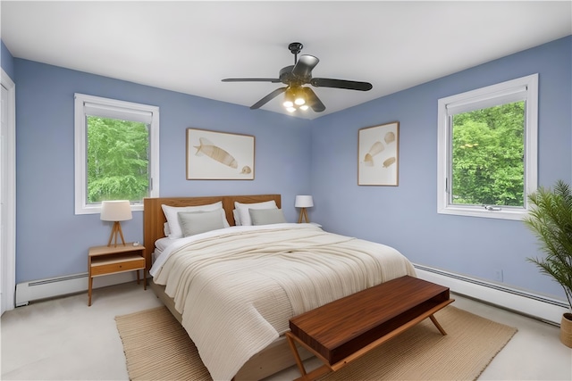 121 W Shore Dr, Exeter, RI 02822 - bedroom featuring baseboard heating, multiple windows, and ceiling fan