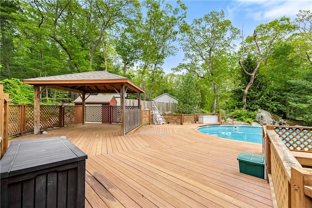 121 W Shore Dr, Exeter, RI 02822 - wooden terrace with a gazebo, an outdoor pool, and view of wooded area