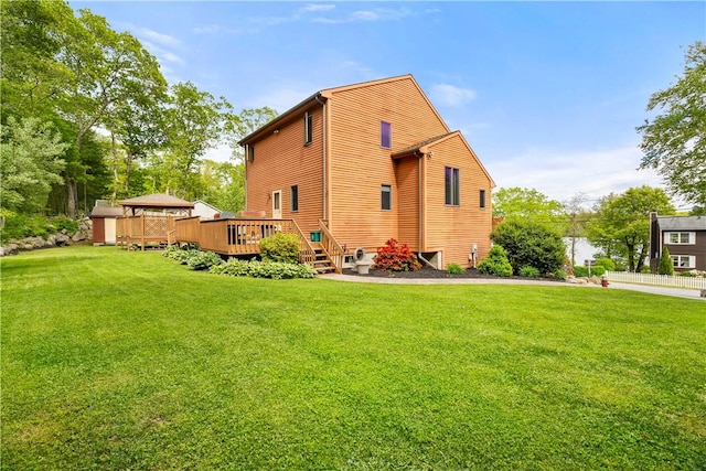 121 W Shore Dr, Exeter, RI 02822 - view of home's exterior featuring a wooden deck and a yard