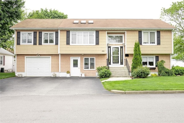 290 E View Ave, Cranston, RI 02920 - raised ranch with driveway, an attached garage, and a front lawn