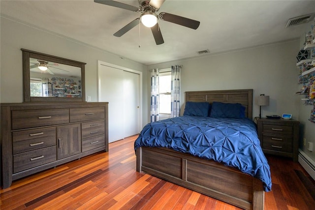 290 E View Ave, Cranston, RI 02920 - bedroom featuring wood finished floors, ceiling fan, and a baseboard radiator
