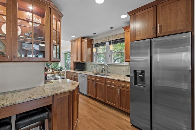 77 Friendly Rd, Cranston, RI 02910 - kitchen with stainless steel appliances, a sink, tasteful backsplash, recessed lighting, and light stone countertops