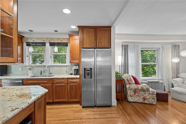 77 Friendly Rd, Cranston, RI 02910 - kitchen featuring stainless steel appliances, a sink, plenty of natural light, radiator, and recessed lighting